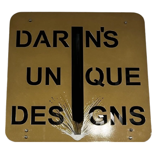 Custom metal Darin's Unique Designs sign showcasing the company's welding and fabrication work.